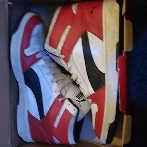 I am selling a pair of red and white pumas in size 13